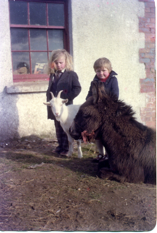 Eamon and his sister with a goat, Northern Ireland
